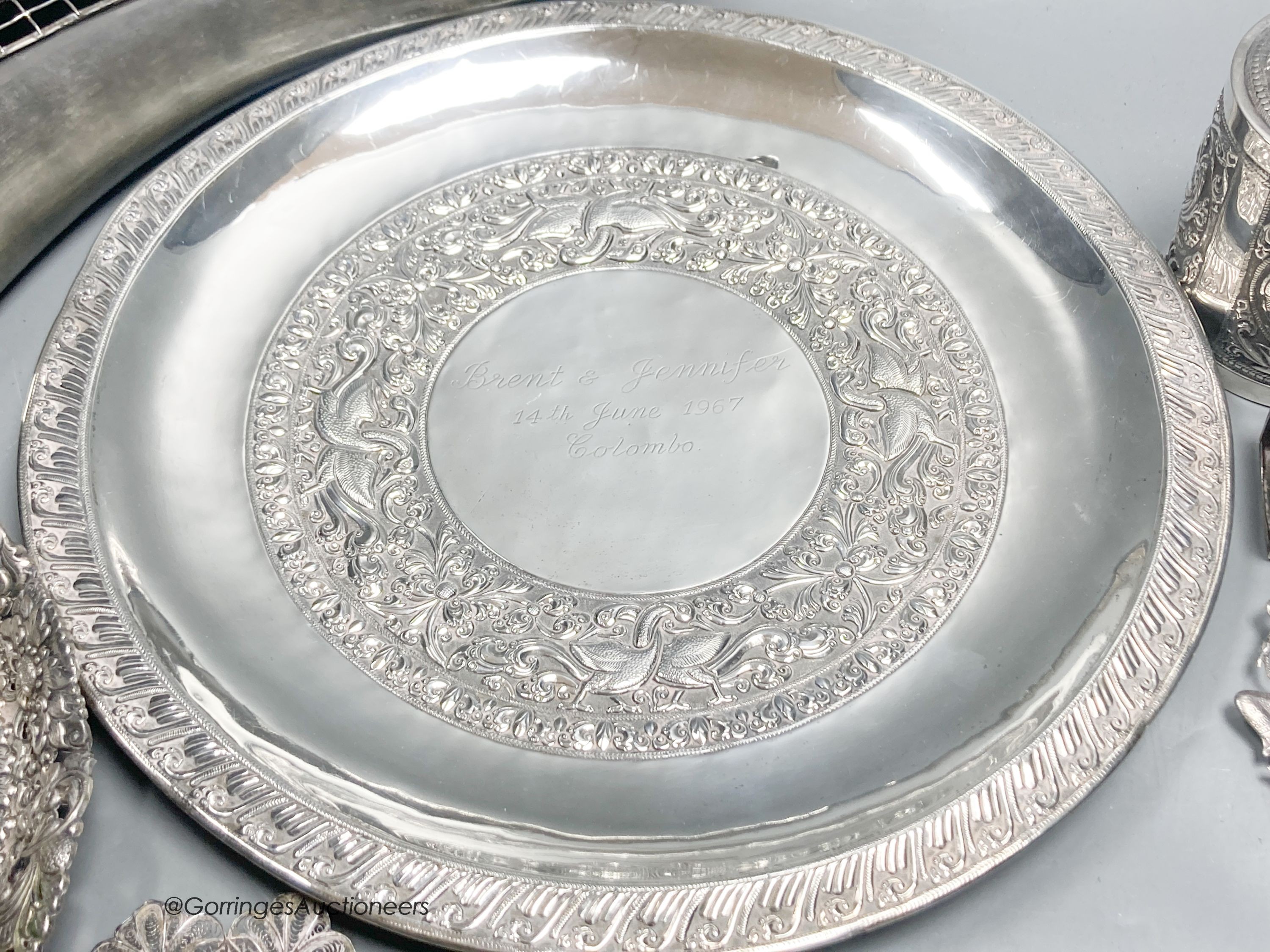 A Malaysian white metal mounted horn, a Thai cylindrical container and cover, other Thai and Eastern white metal items.